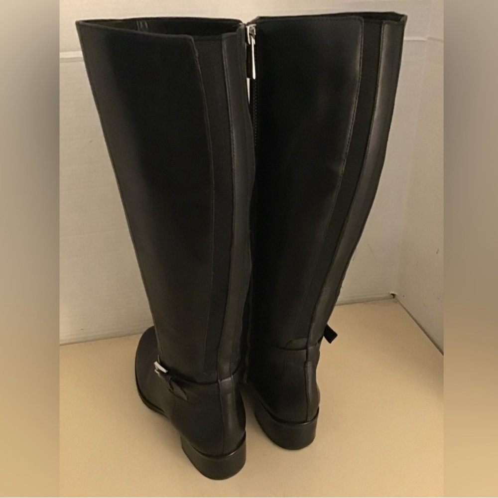 Never wore still in box. Women's Black Knee-High Boots.